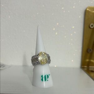 Elegant Silver and Yellow Gemstone Ring